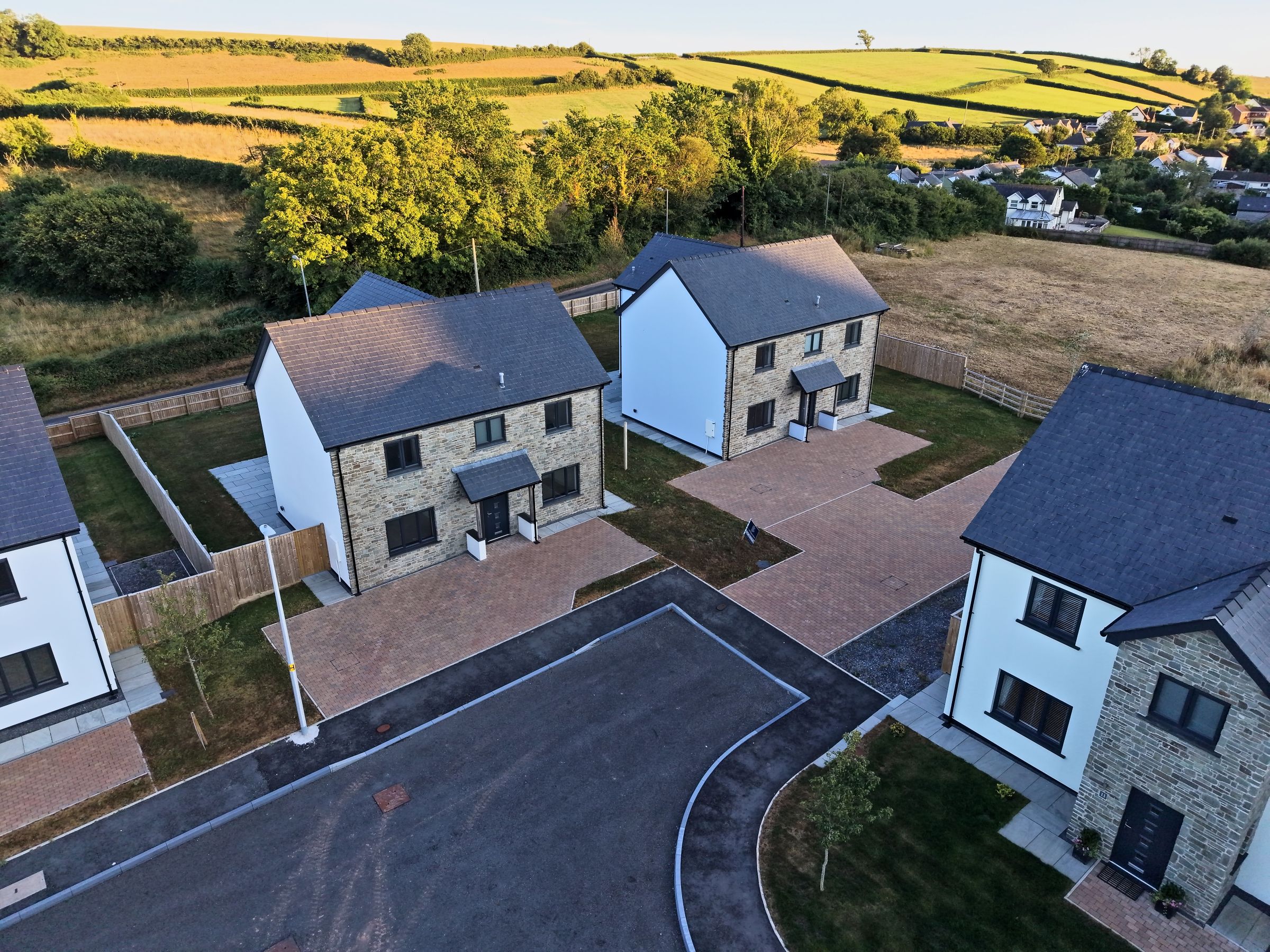 Cl&ocirc;s Hugdon, Laugharne &mdash; a cluster of the completed homes from the air