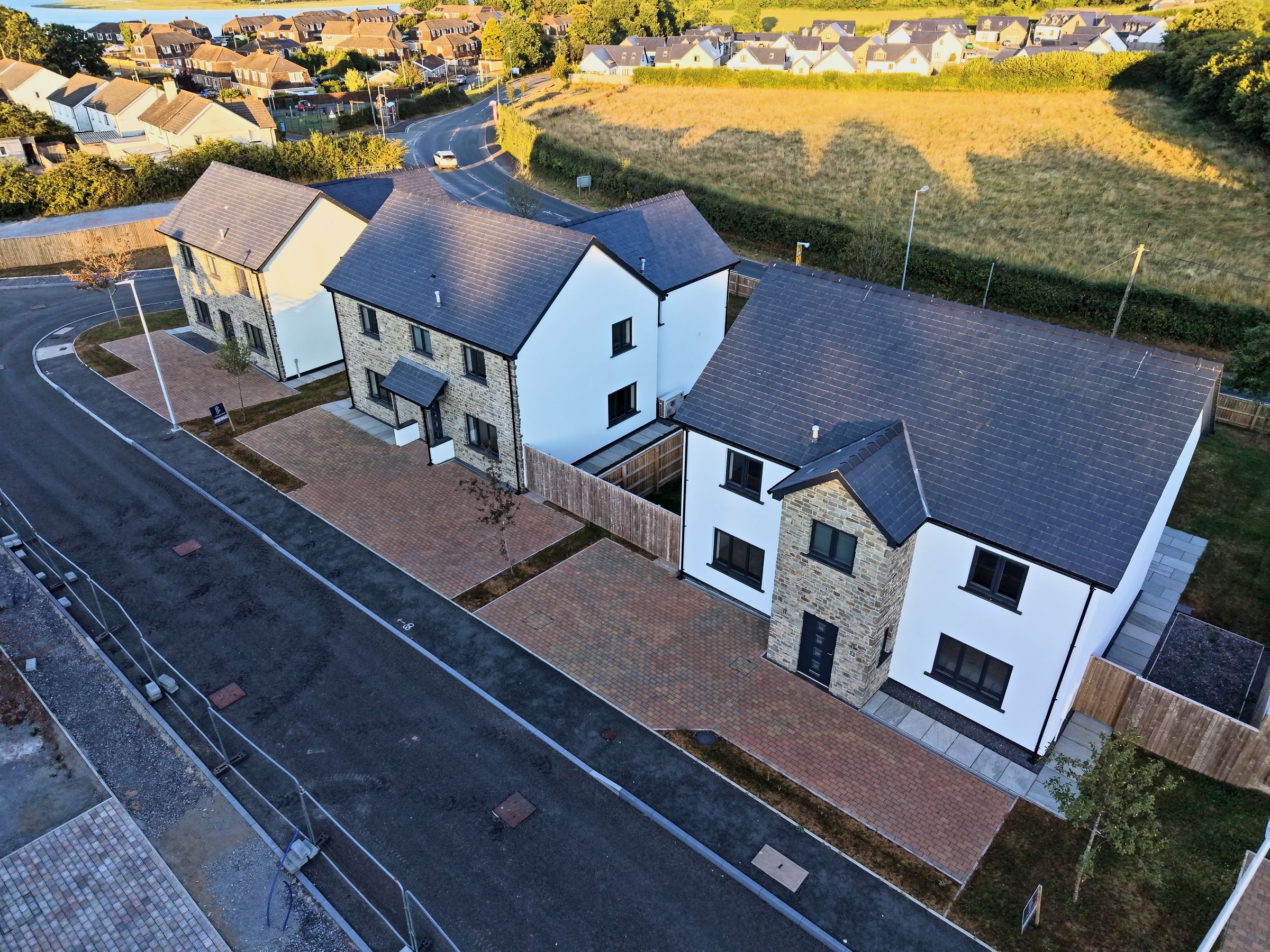 Cl&ocirc;s Hugdon, Laugharne &mdash; a completed new home, front elevation from the air