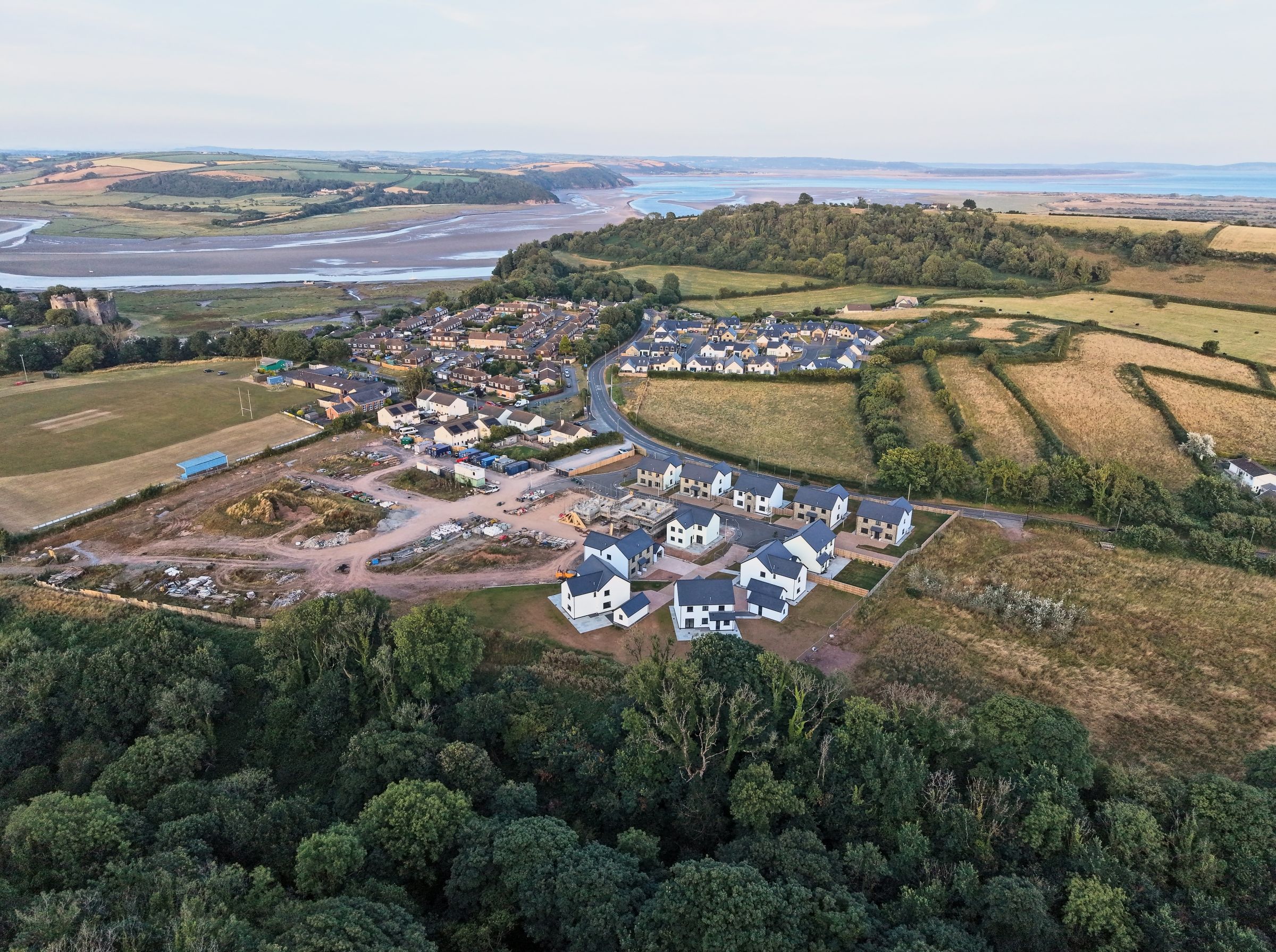 Cl&ocirc;s Hugdon, Laugharne &mdash; the development with the T&acirc;f estuary behind