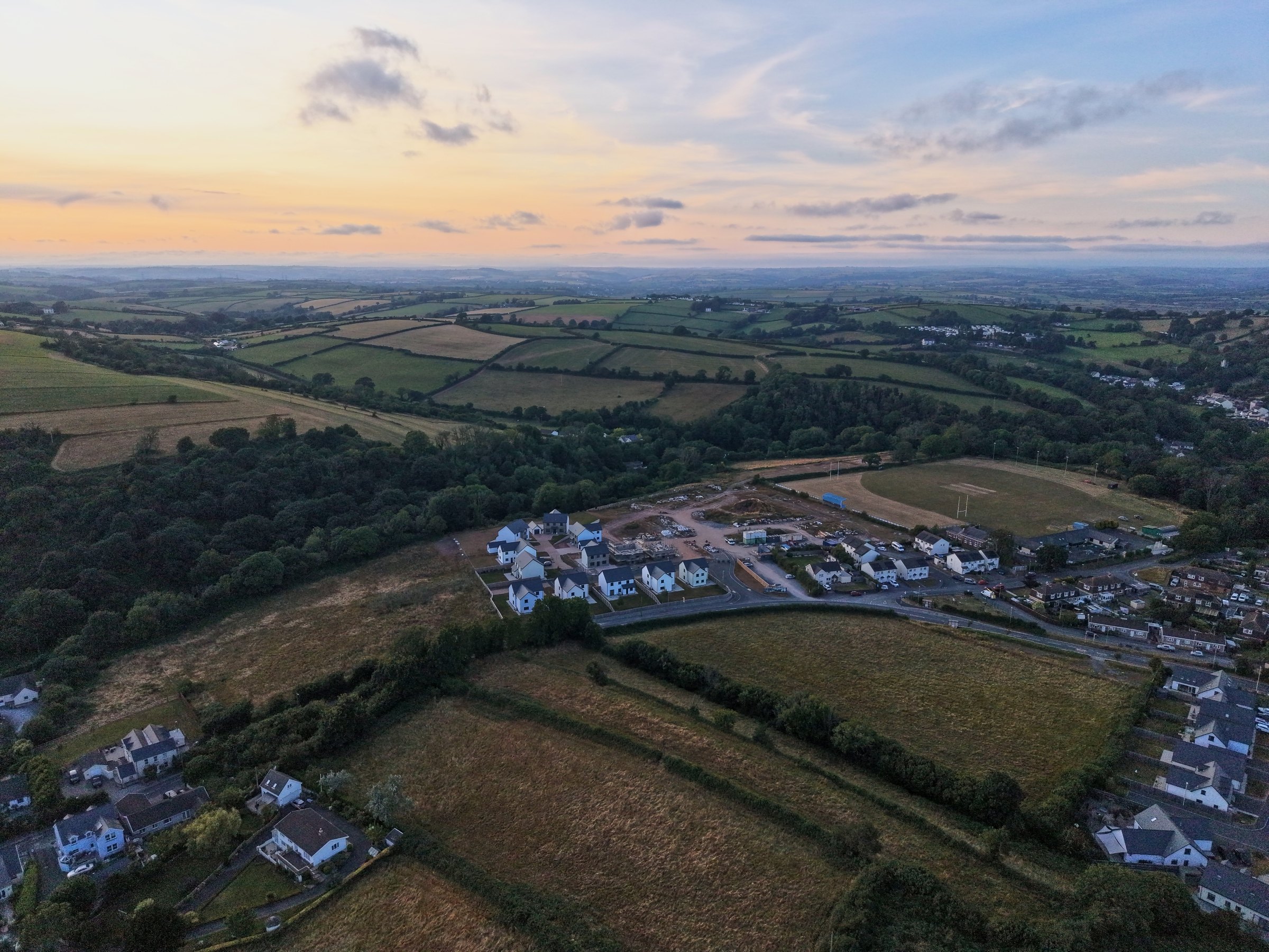 Laugharne at dusk from the air, with Cl&ocirc;s Hugdon on the edge of the town