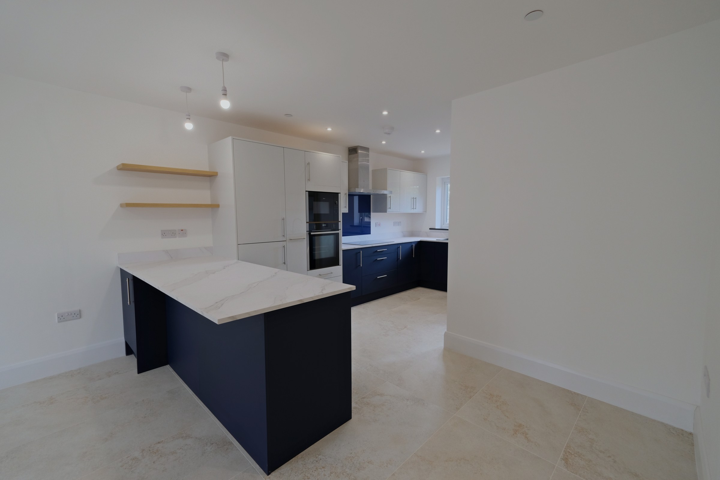 House 5, The Oak &mdash; the fitted kitchen with island, marble-effect worktops and integrated appliances