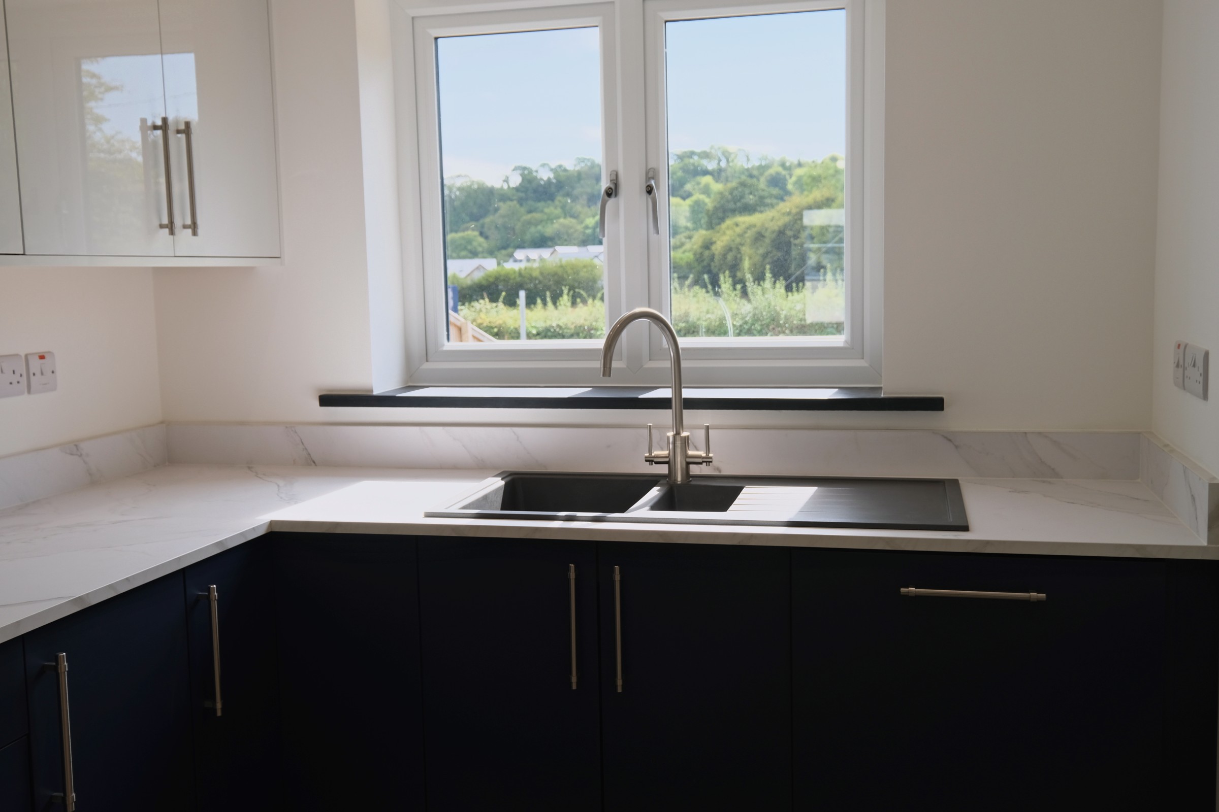 House 5, The Oak &mdash; the kitchen with the window over the sink looking to the green valley